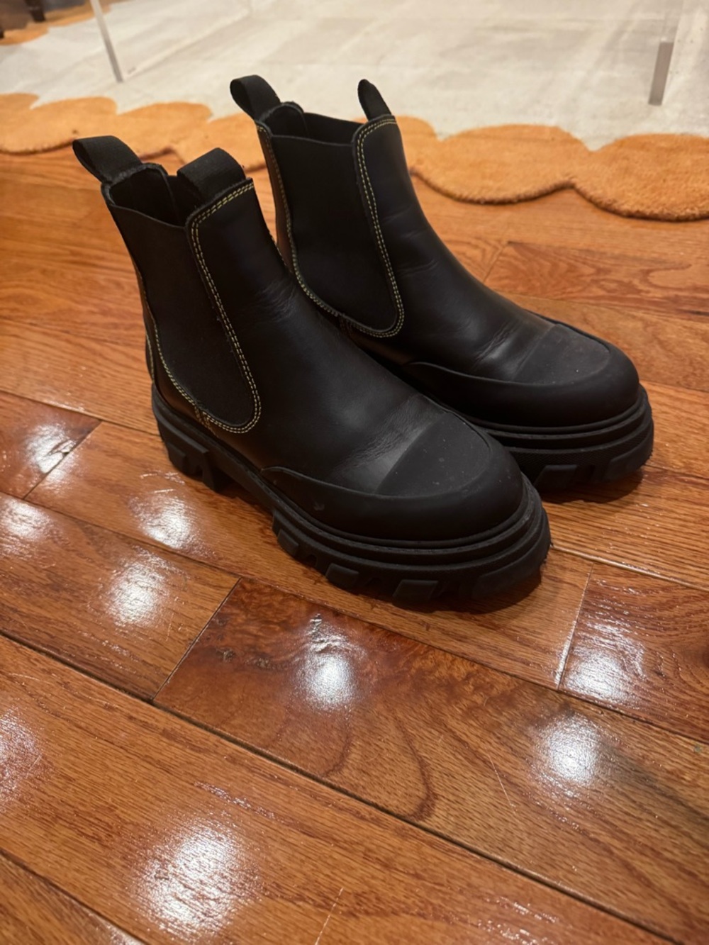 Barley been worn black Ganni boots with yellow stitching